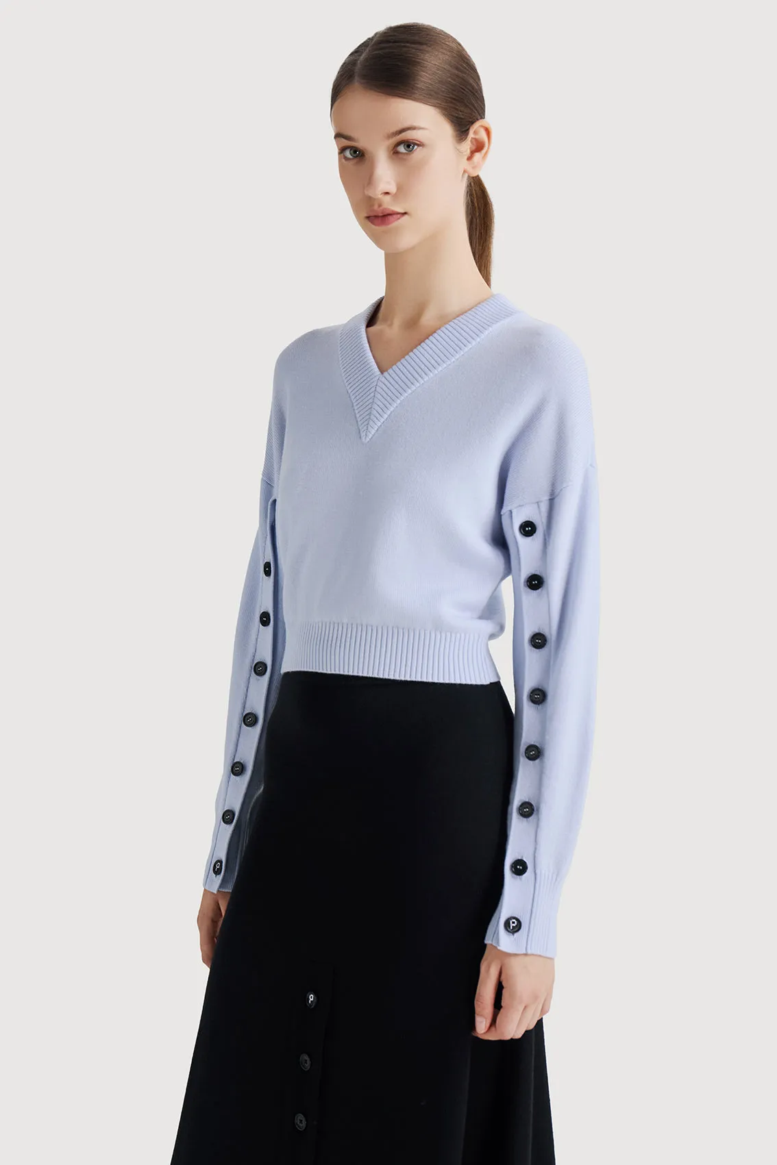 Cozy Knitwear with Contrast Buttons at Sleeves